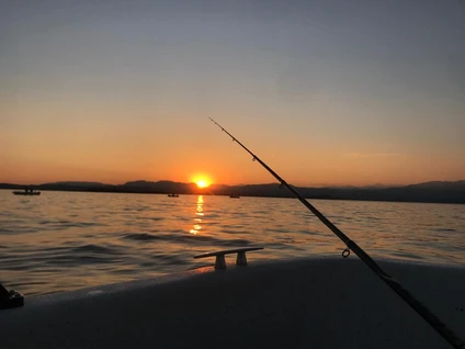 Fishing for sardines from the motorboat on Lake Garda at sunset 4